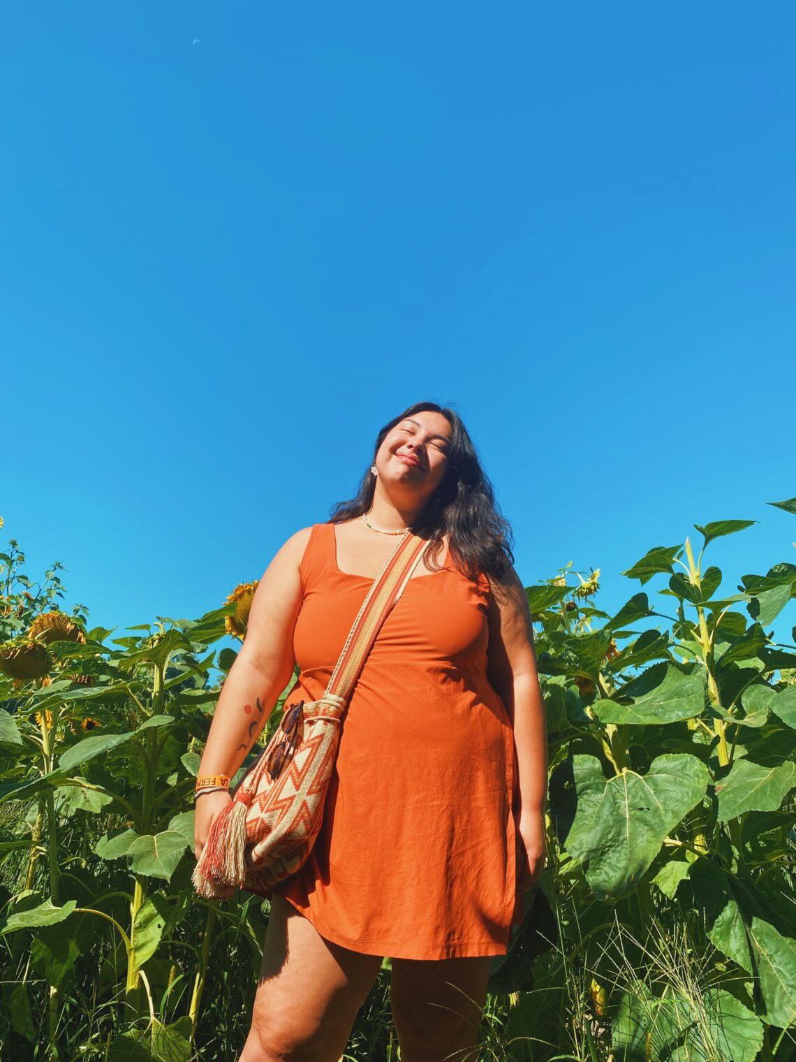 Photo of woman wearing a dress in a field of corn.